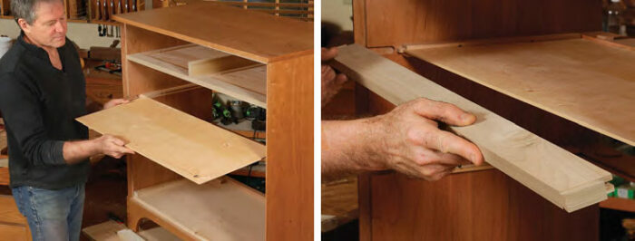 Tom placing a light colored piece of wood in slots mounted in the case.