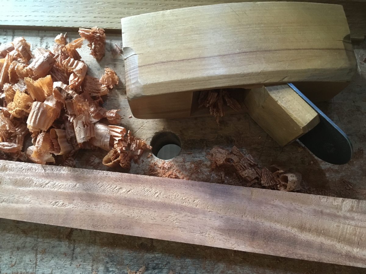 mahogany board showing tear-out from a smoothing plane