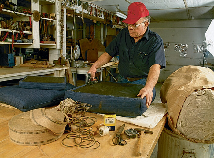 morris chair seat cushion being stapled